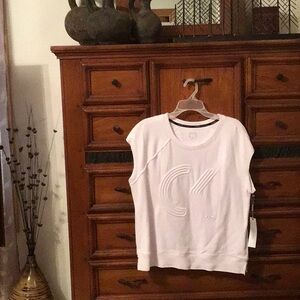 New, women’s extra large, Calvin Klein performance top with tags.
